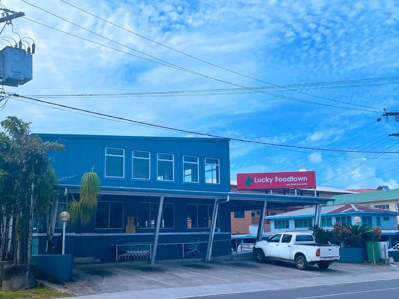 The Lucky Foodtown shop in Apia: a blue two-storey building with a red Lucky Foodtown sign.